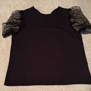 Elegant Black Top with Sheer Polka Dot Sleeves